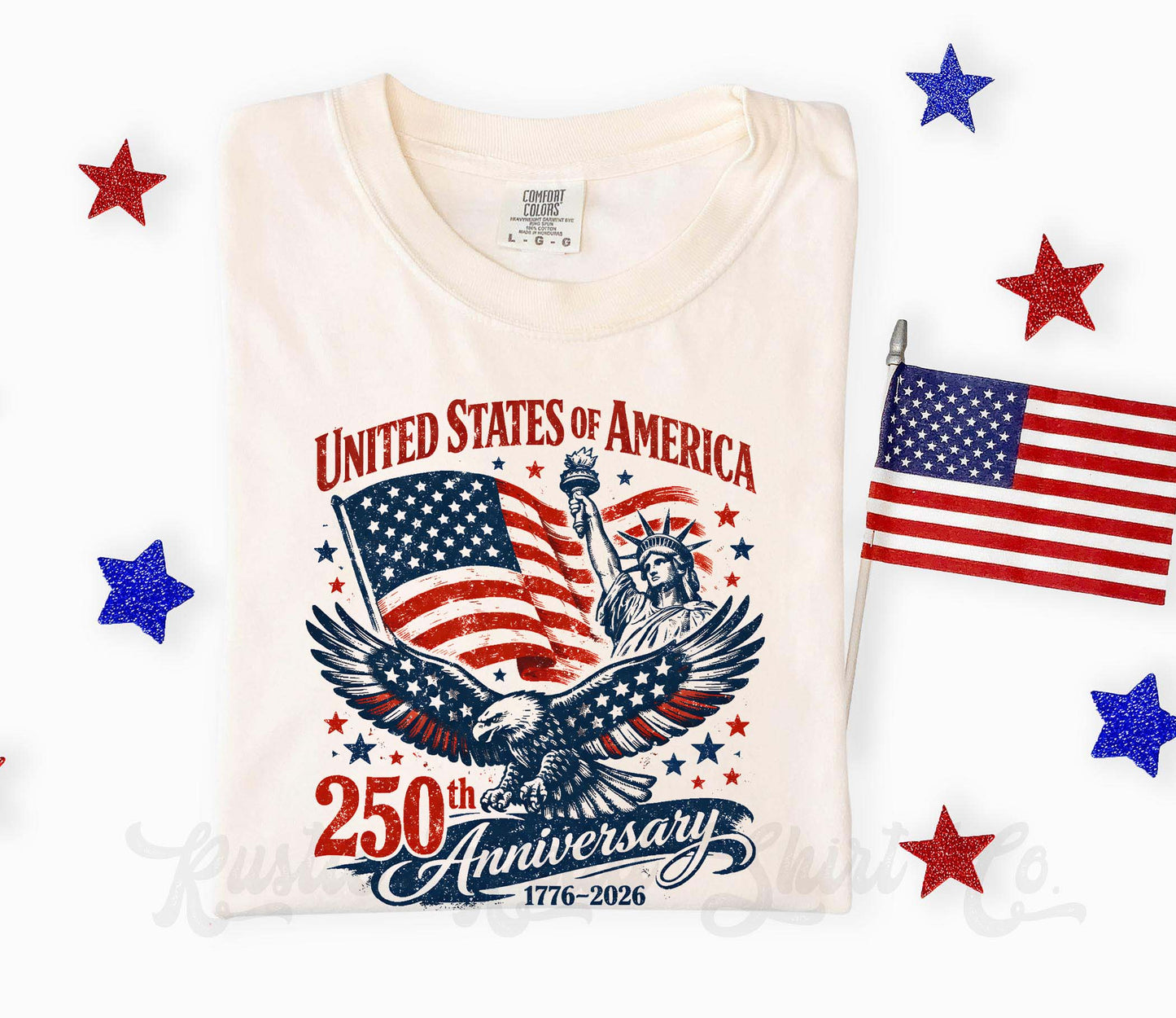 White t-shirt with 'United States of America 250th Anniversary' design featuring an eagle, flag, and Statue of Liberty on a white background with American flags and stars.