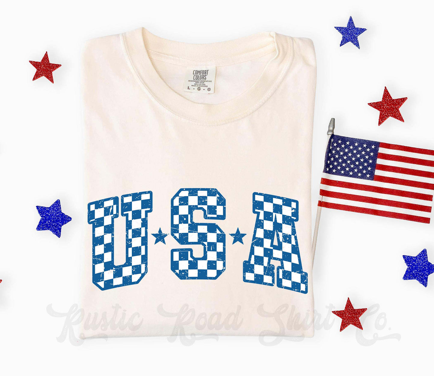 White t-shirt with 'USA' in checkered letters, American flag, and stars on a white background